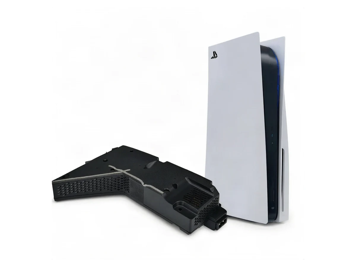 PlayStation 5 console beside its internal power supply assembly